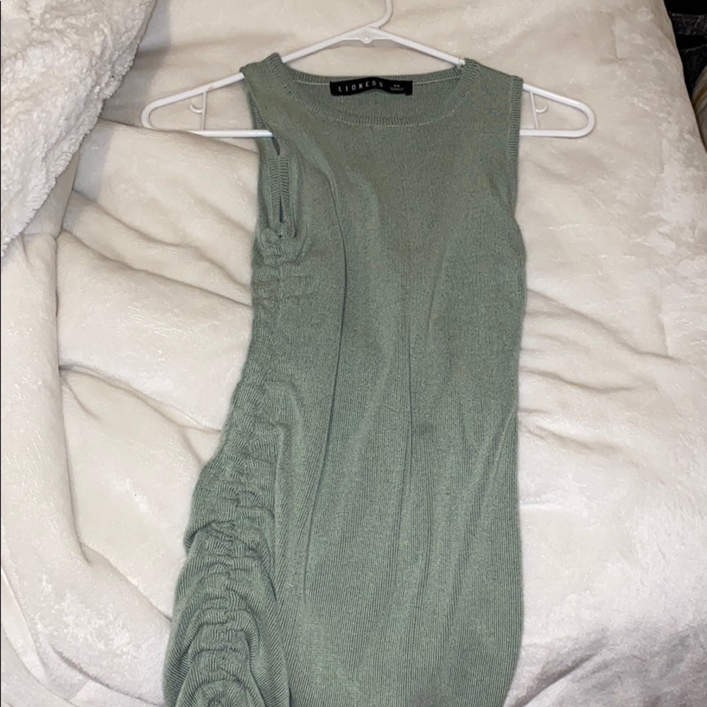 Green dress that snitches up on the sides